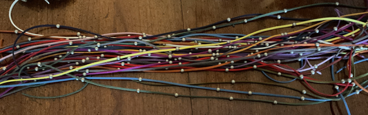 Silver beads on suede